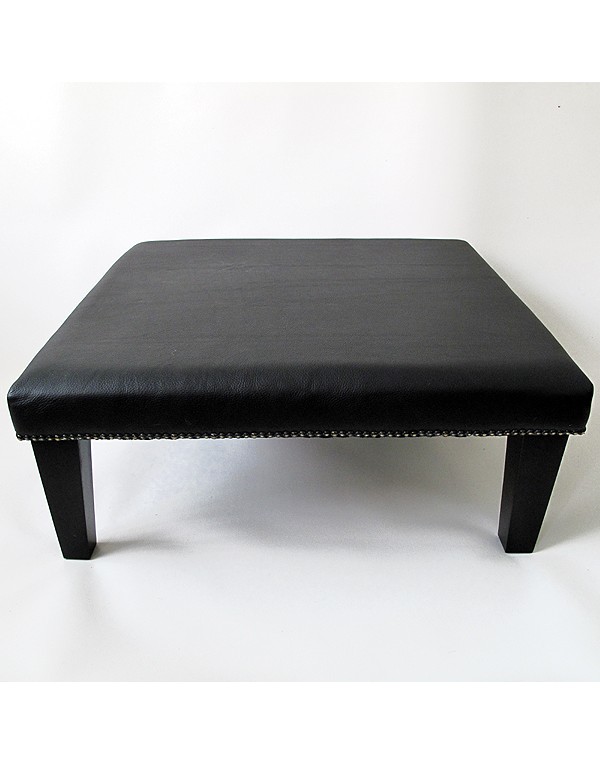 Plain black grained leather footstool 114 with modern tapered black leg
