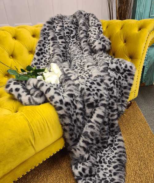 Grey and black spotted animal print faux fur sofa throw