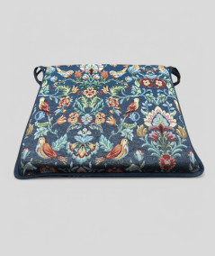 Multicoloured square tapestry seat pads on a blue background