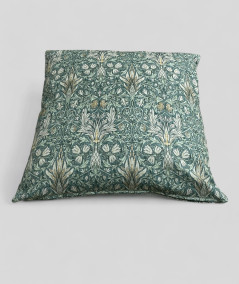 Square sofa cushions with a William Morris green pattern
