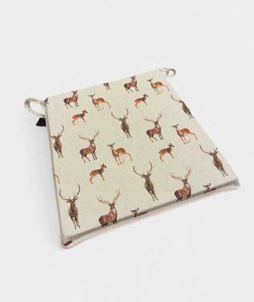 Beige tapered seat pads with a stag and deer print