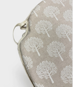 Beige spindle seat pads with a modern white tree design