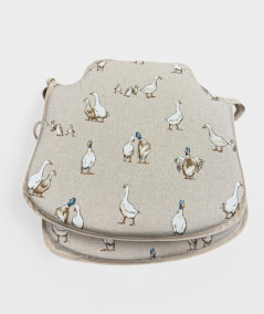 Modern shaped seat pads in a natural linen beige with a modern white duck print