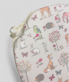 Extra thick spindle chair pads with a woodland animal print