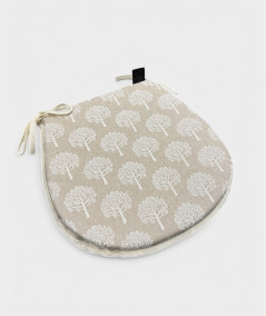 Beige D shaped seat pads with a white tree design