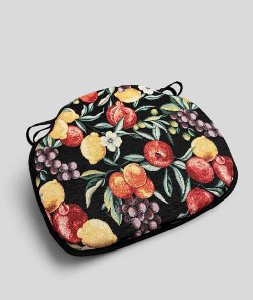 Spindle shaped chair pads in a black tapestry fabric with a bold multicoloured fruit print