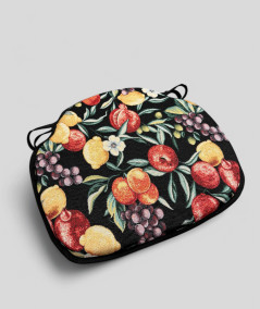 Spindle shaped chair pads in a black tapestry fabric with a bold multicoloured fruit print
