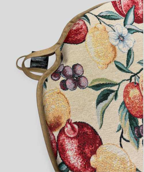 Spindle shaped seat pads with a multicoloured fruit design on a beige base