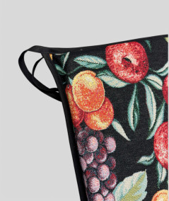 Multi-coloured square seat pads with a modern fruit design on a rich black tapestry base
