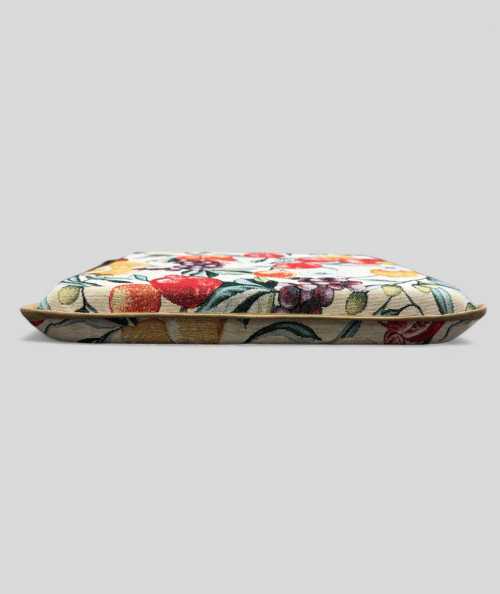 Multi-coloured square seat pads with a modern fruit design on a rich beige tapestry base