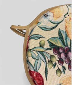 Multicoloured round bistro tapestry chair pads with a modern fruit design on a beige base