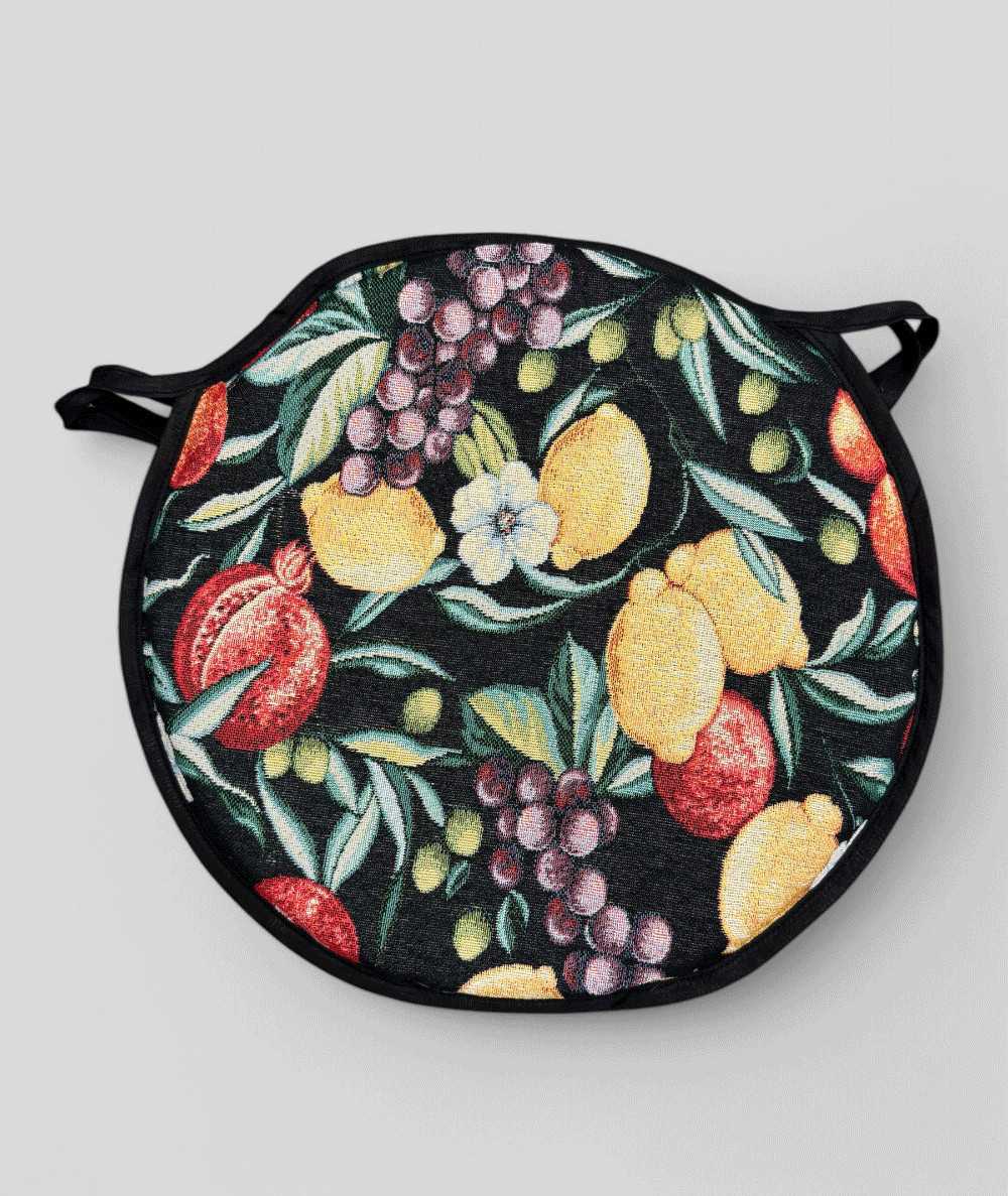 Multicoloured round bistro tapestry seat pads with a modern fruit design on a black base