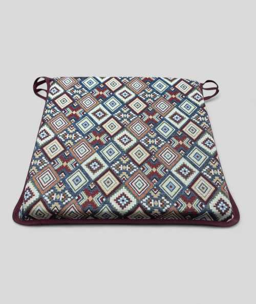 Square shaped multi-coloured seat pads in a geometric patterned tapestry fabric