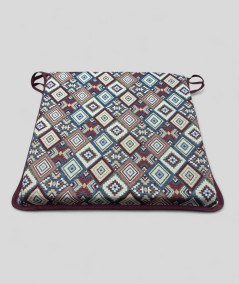 Square shaped multi-coloured seat pads in a geometric patterned tapestry fabric