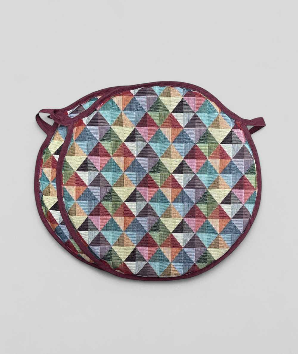Multicoloured round shaped bistro seat pads in a modern geometric diamond pattern