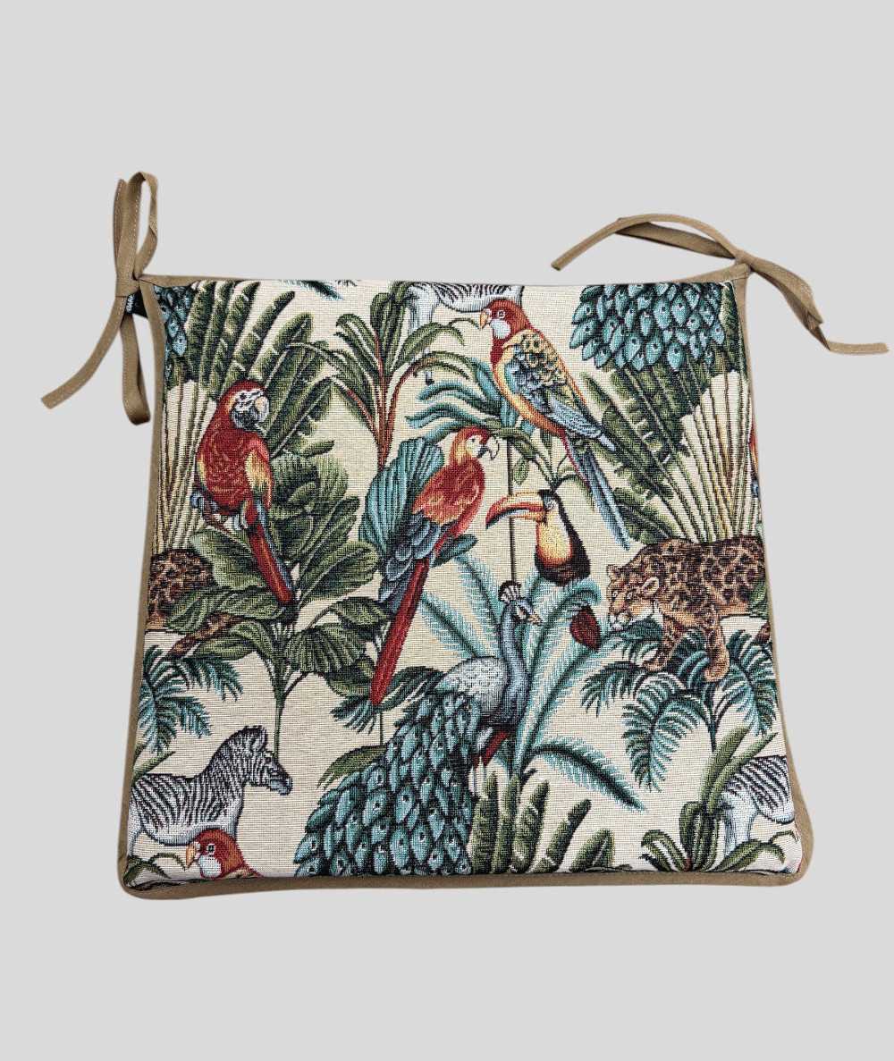 Multi-coloured square chair pads with a modern rainforest design on a warm beige tapestry base