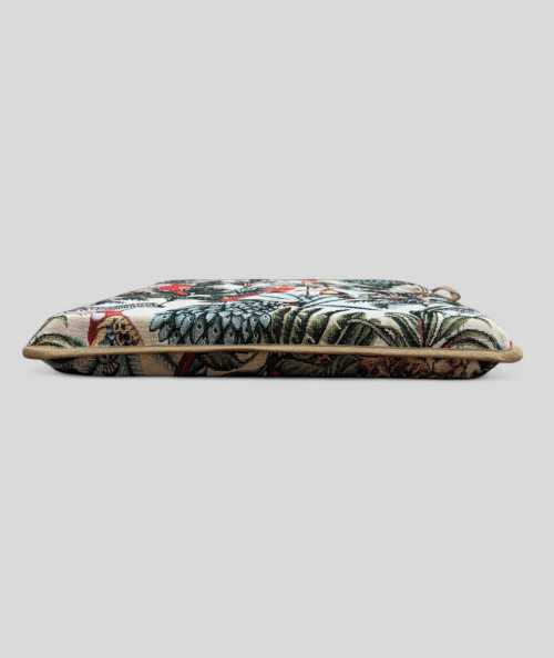 Multi-coloured square chair cushions with a modern rainforest design on a warm beige tapestry base