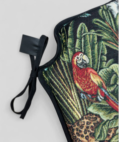 Spindle shaped chair pads in a black tapestry fabric with a bold multicoloured jungle print