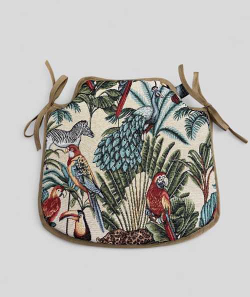Spindle shaped chair pads in a natural tapestry fabric with a bold multicoloured rainforest print