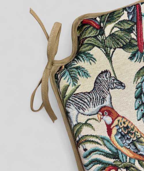 Spindle shaped chair pads in a natural tapestry fabric with a bold multicoloured jungle print