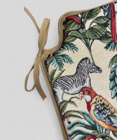 Spindle shaped chair pads in a natural tapestry fabric with a bold multicoloured jungle print