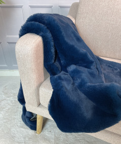 Plain blue faux fur bed runner